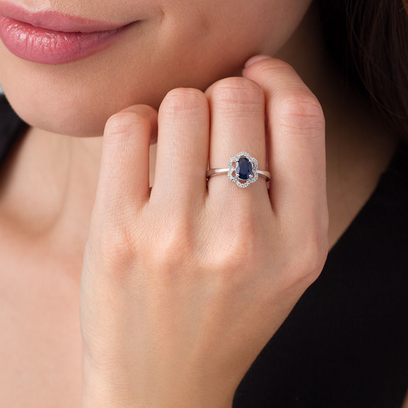 Oval Blue Sapphire and 1/15 CT. T.W. Scallop Frame Floral Ring in 10K White Gold