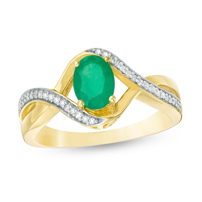 Main Image 1 of Oval Emerald and 1/10 CT. T.W. Diamond Swirl Frame Bypass Ring in 10K Gold