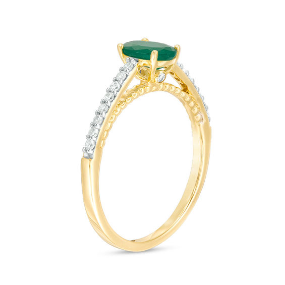 Oval Emerald and 1/6 CT. T.w. Diamond Beaded Ring in 10K Gold