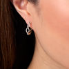 Thumbnail Image 1 of 1/4 CT. T.W. Diamond Twist Hoop Earrings in 10K Gold