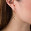 Thumbnail Image 2 of Criss-Cross Hoop Earrings in 14K Gold
