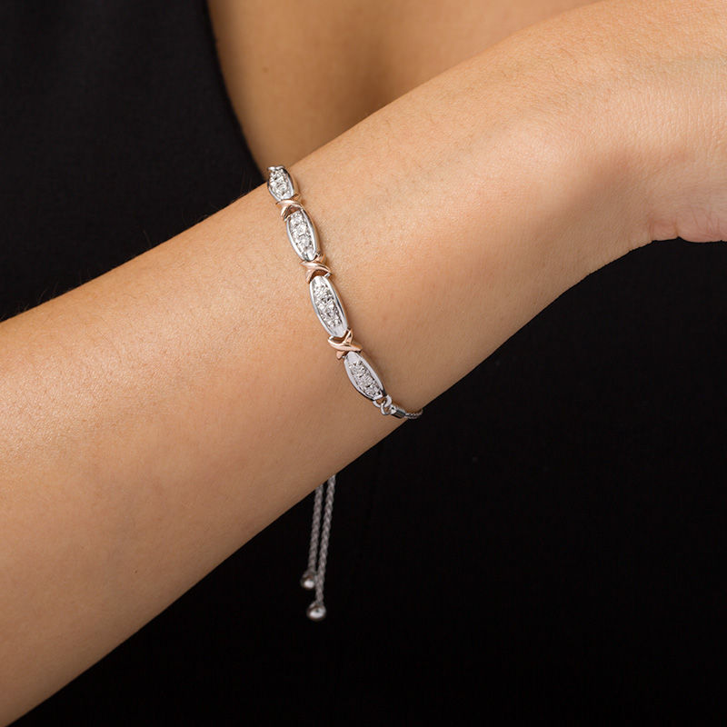 Main Image 2 of 1/20 CT. T.W. Diamond Fashion "X" Bolo Bracelet in Sterling Silver and 10K Rose Gold - 9.5"