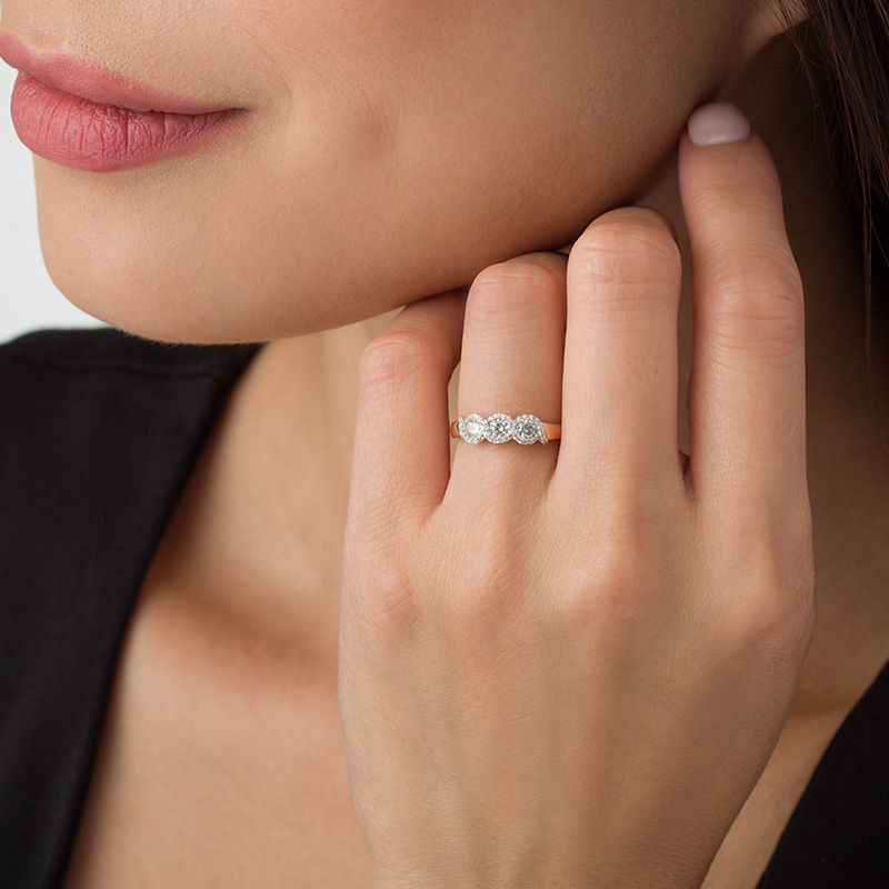 1/2 CT. T.W. Diamond Three Stone Twist Frame Engagement Ring in 10K Rose Gold