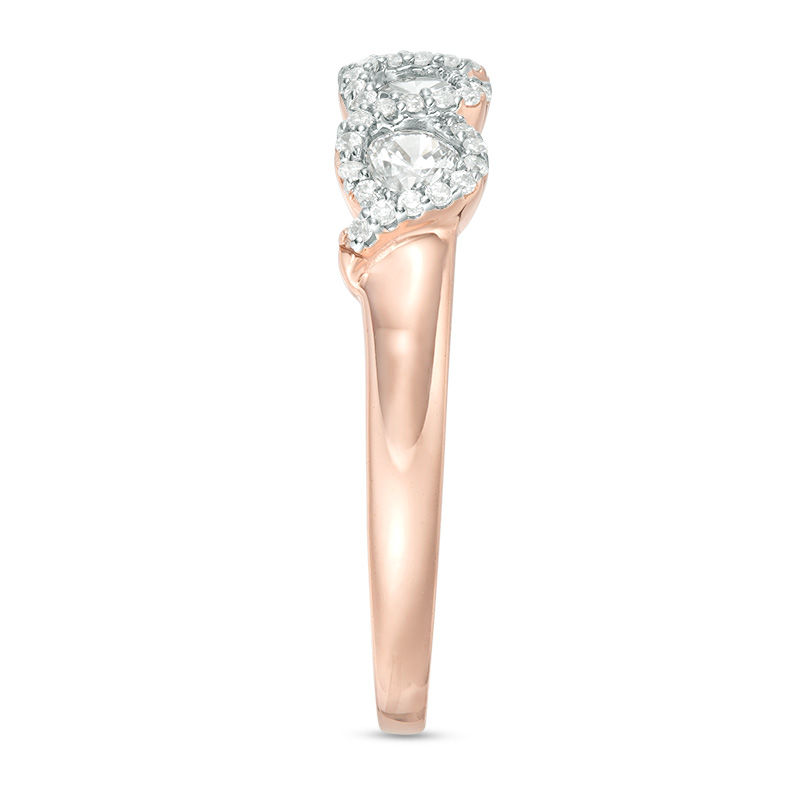 1/2 CT. T.W. Diamond Three Stone Twist Frame Engagement Ring in 10K Rose Gold