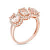 Thumbnail Image 1 of Oval Morganite and White Topaz Frame Three Stone Ring in 10K Rose Gold