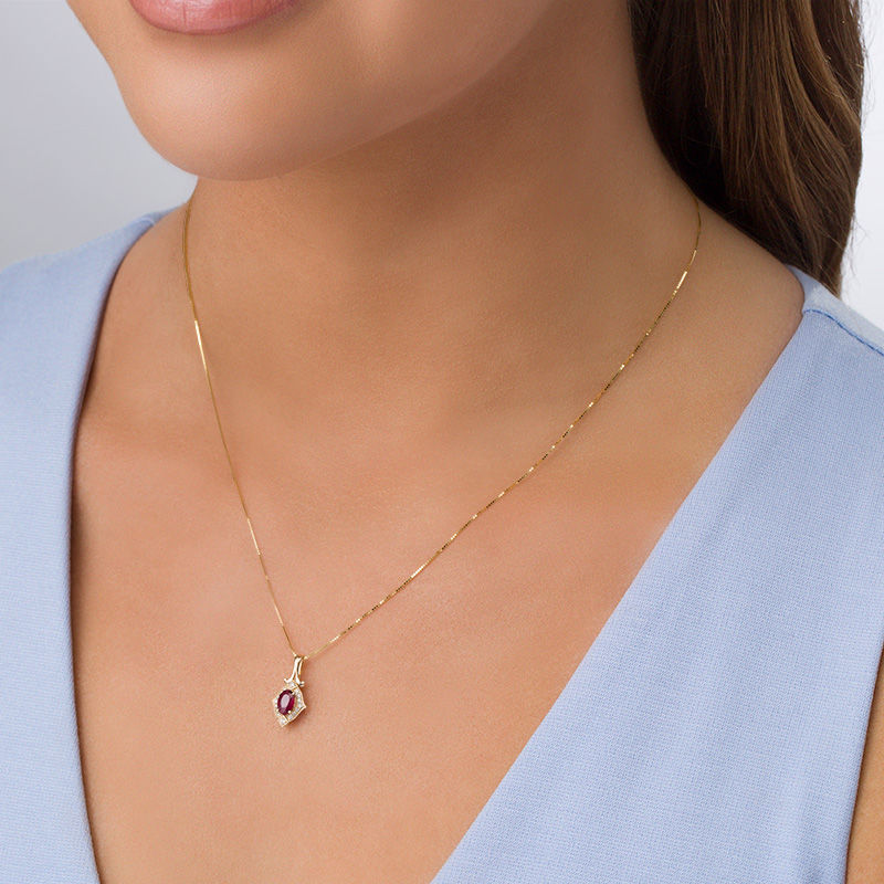 Main Image 2 of Oval Ruby and 1/20 CT. T.W. Diamond Vintage-Style Frame Doorknocker Pendant in 10K Gold