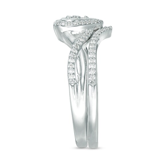 1/5 CT. T.w. Diamond Heart Frame Twist Bridal Set in 10K White Gold