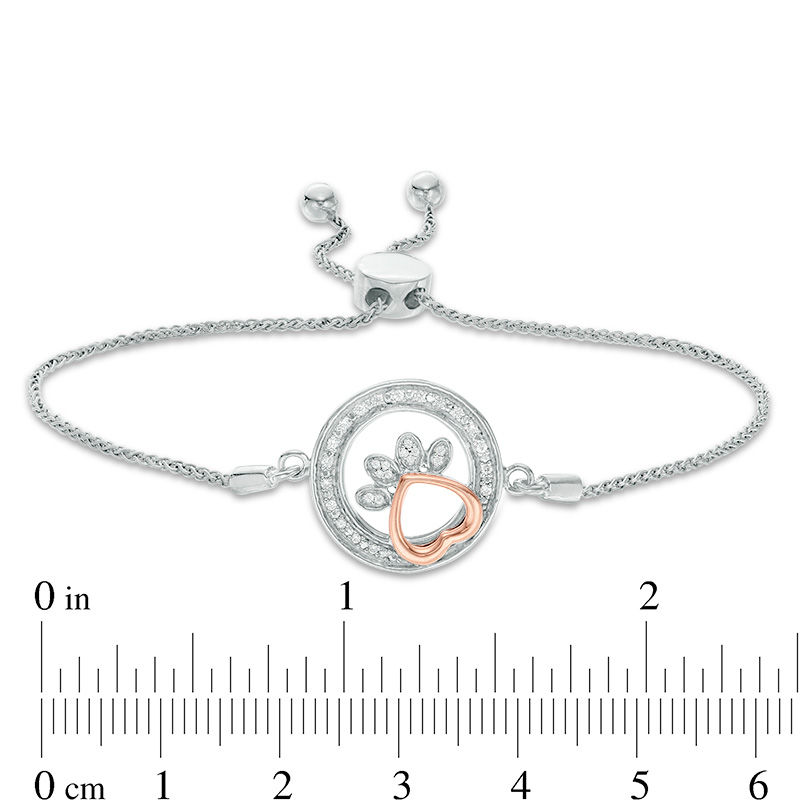 Main Image 2 of 1/15 CT. T.W. Diamond Open Circle Paw Print Bolo Bracelet in Sterling Silver and 10K Rose Gold - 9.5"