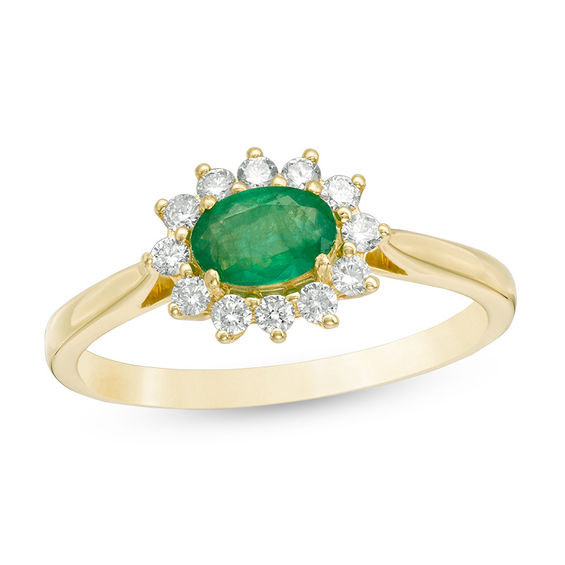 Oval Emerald and 1/5 CT. T.w. Diamond Starburst Frame Ring in 10K Gold