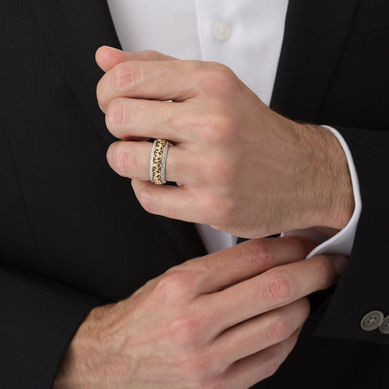 1/8 CT. T.w. Diamond Love Knot Wedding Band in 14K Two-Tone Gold