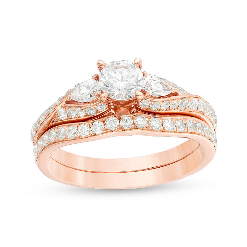Main Image 1 of 1-3/8 CT. T.W. Diamond Bypass Three Stone Bridal Set in 14K Rose Gold