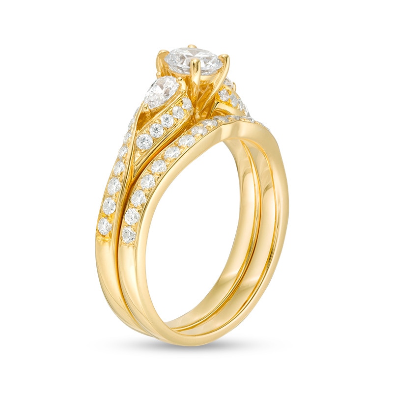 Main Image 3 of 1-3/8 CT. T.W. Diamond Bypass Ribbon Three Stone Bridal Set in 14K Gold