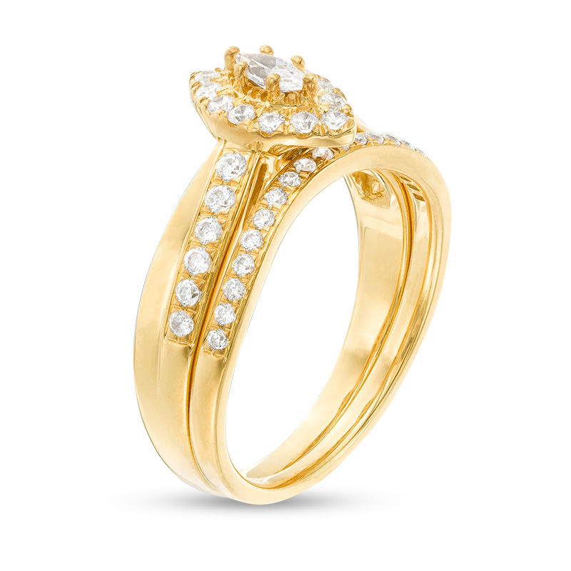 5/8 CT. T.W. Marquise Diamond Frame Crossover Bridal Set in 14K Gold ...