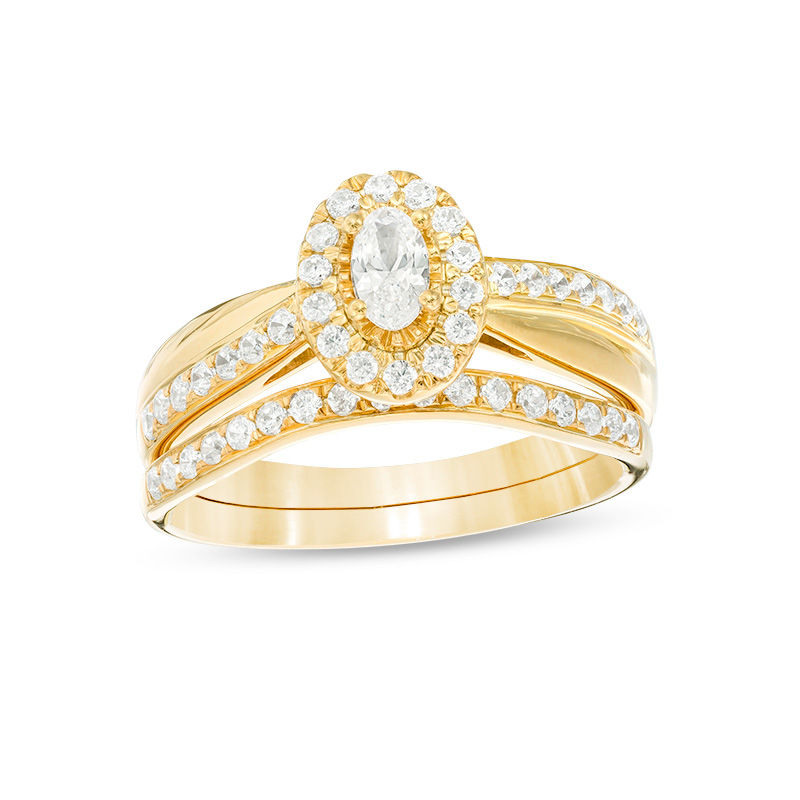 3/4 CT. T.W. Oval Diamond Frame Crossover Bridal Set in 14K Gold