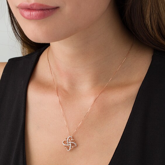 1/6 CT. T.w. Diamond Clover Heart Knot Pendant in 10K Rose Gold