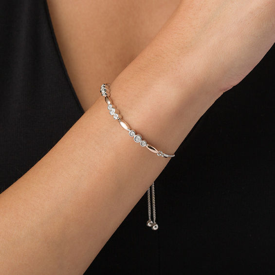 1/20 CT. T.w. Diamond Three Stone and Bar Station Bolo Bracelet in Sterling Silver and 10K Rose Gold - 9.5"
