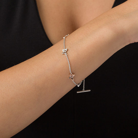 1/20 CT. T.w. Diamond Open Butterfly Station Bracelet in Sterling Silver and 10K Rose Gold