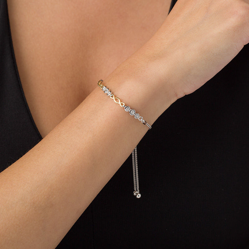 Main Image 2 of 1/20 CT. T.W. Diamond Alternating Twist Bolo Bracelet in Sterling Silver and 10K Gold - 9.5"