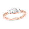 1/3 CT. T.W. Diamond Three Stone Filigree Scroll Engagement Ring in 10K Rose Gold