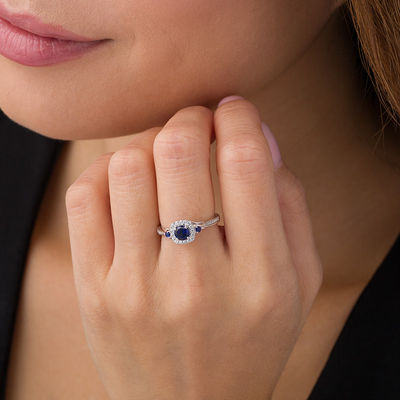 Lab-Created Blue Sapphire and 1/6 CT. T.W. Diamond Cushion Frame Crossover  Shank Engagement Ring in 10K White Gold|Zales