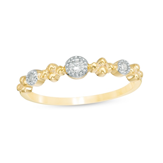 1/15 CT. T.w. Diamond Three Stone Beaded Band in 10K Gold