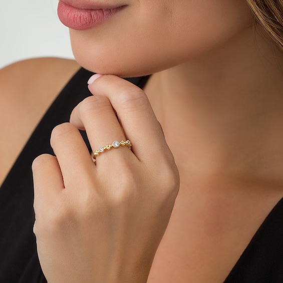 1/15 CT. T.w. Diamond Three Stone Beaded Band in 10K Gold