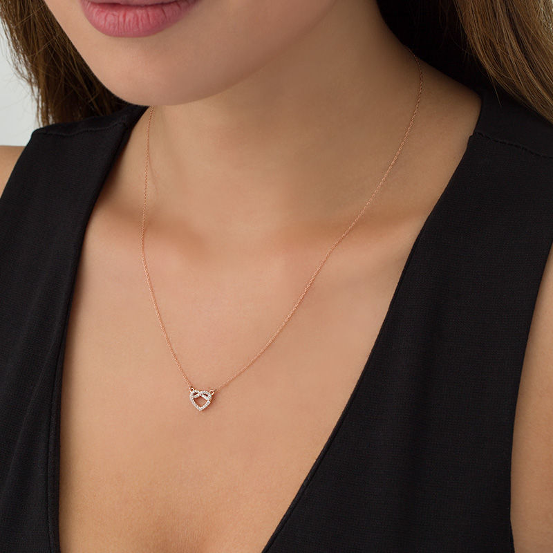 Main Image 2 of 1/15 CT. T.W. Diamond Pretzel Love Knot Heart Necklace in 10K Rose Gold