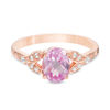 Thumbnail Image 0 of Oval Lab-Created Pink Sapphire and 1/10 CT. T.W. Diamond Leaf Sides Ring in 10K Rose Gold