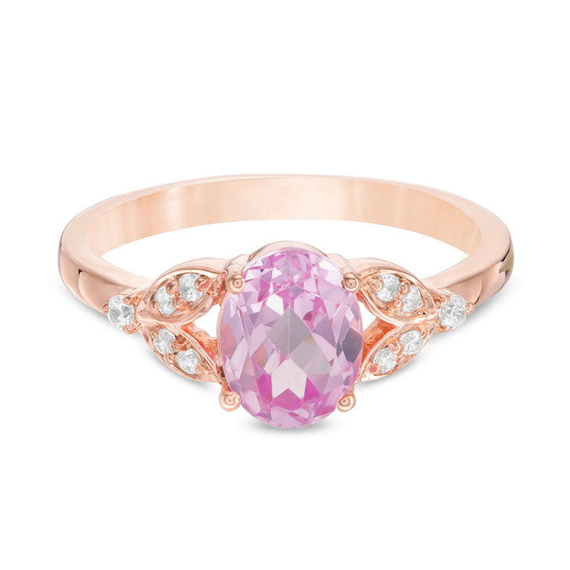 Oval Lab-Created Pink Sapphire and 1/10 CT. T.W. Diamond Leaf Sides Ring in 10K Rose Gold