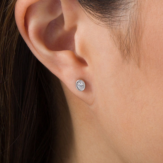 1/6 CT. T.W. Diamond Solitaire Oval-Shaped Stud Earrings in 10K White Gold 1/6 CT. T.W. Diamond Solitaire Oval-Shaped Stud Earrings in 10K White Gold