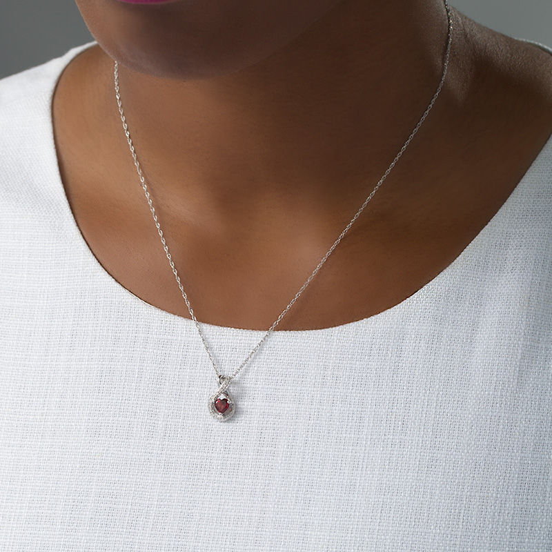 5.0mm Heart-Shaped Garnet and 1/20 CT. T.W. Diamond Infinity Pendant in Sterling Silver