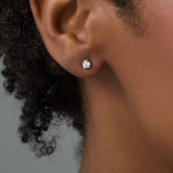 1/ CT. T.w. Diamond Illusion Solitaire Stud Earrings in 10K White Gold