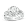 Thumbnail Image 1 of Lab-Created White Sapphire and 1/6 CT. T.W. Diamond Three Stone Bypass Vintage-Style Bridal Set in Sterling Silver