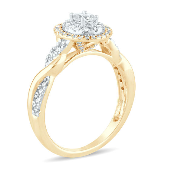 1/2 CT. T.w. Oval Diamond Double Frame Twist Engagement Ring in 14K Gold
