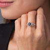Thumbnail Image 2 of Oval Blue Sapphire and 1/5 CT. T.W. Diamond Frame Scrolling Split Shank Ring in 10K White Gold