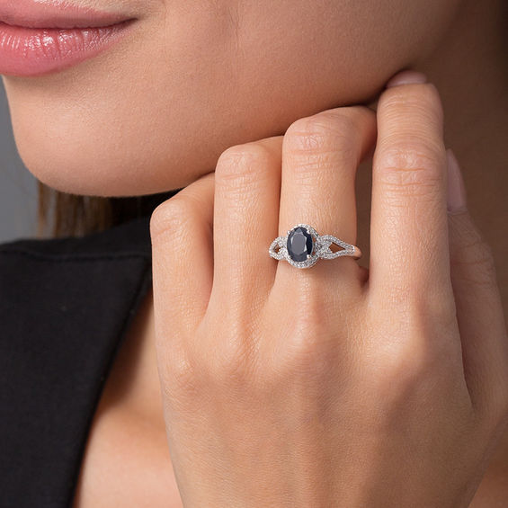 Oval Blue Sapphire and 1/5 CT. T.w. Diamond Frame Scrolling Split Shank Ring in 10K White Gold