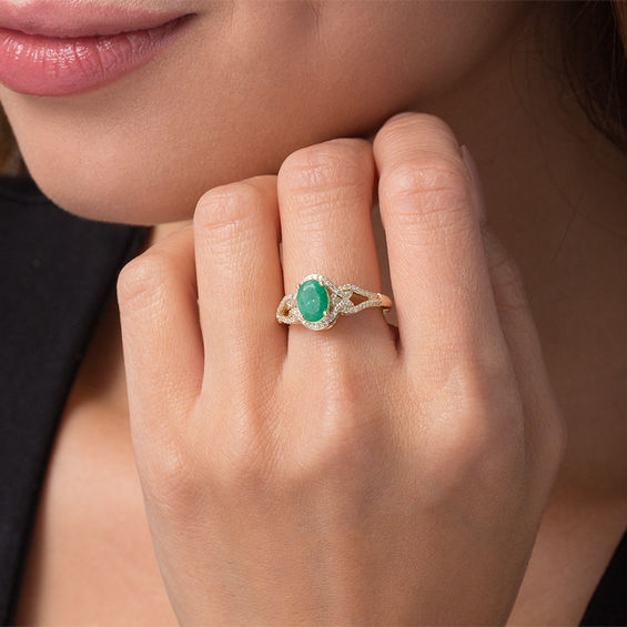 Oval Emerald and 1/5 CT. T.w. Diamond Frame Scrolling Split Shank Ring in 10K Gold