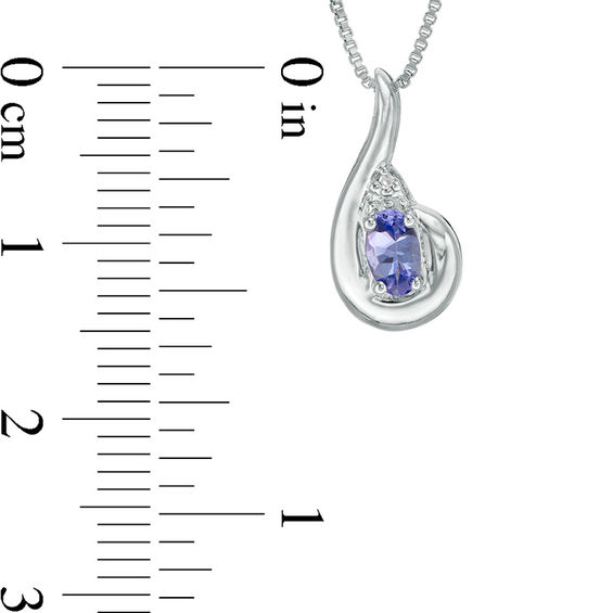 Oval Tanzanite and Diamond Accent Swirl Bypass Pendant and Three Stone Ring Set in Sterling Silver Oval Tanzanite and Diamond Accent Swirl Bypass Pendant and Three Stone Ring Set in Sterling Silver