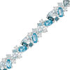 Thumbnail Image 1 of Multi-Shaped Blue and White Topaz Cluster Bracelet in Sterling Silver - 7.5"