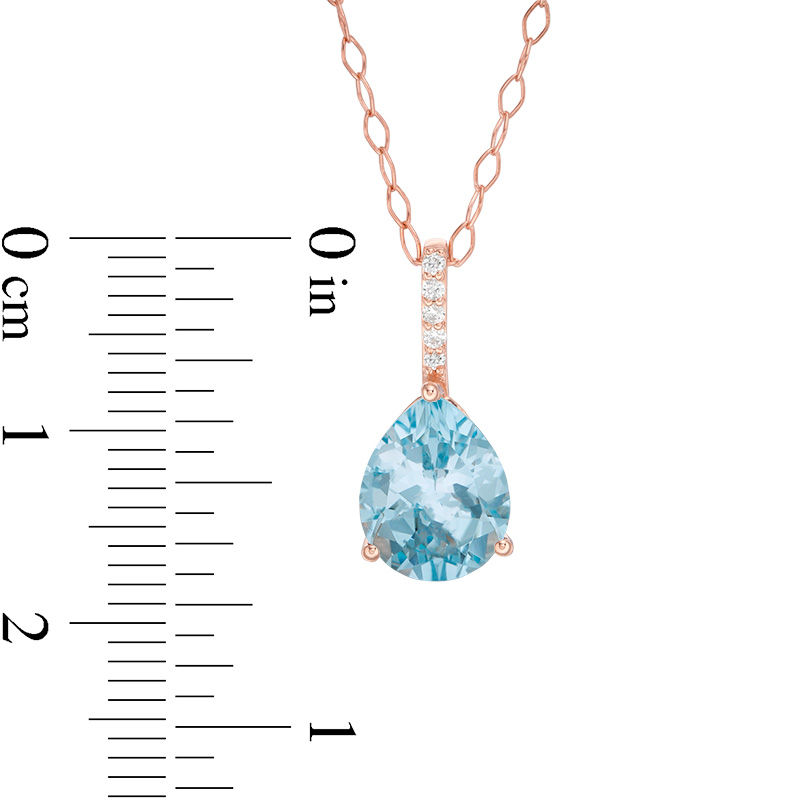 Pear-Shaped Sky Blue Topaz and 1/20 CT. T.W. Diamond Drop Pendant in 10K Rose Gold