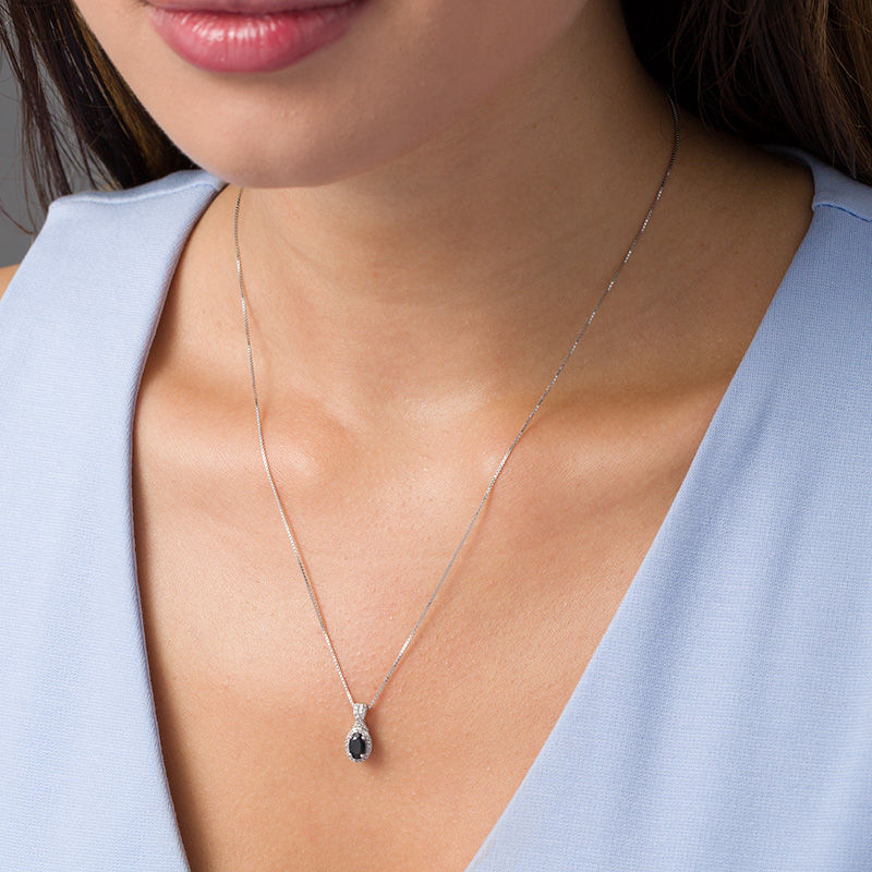 Main Image 2 of Oval Blue Sapphire and 1/10 CT. T.W. Diamond Frame Twist Drop Pendant in 10K White Gold
