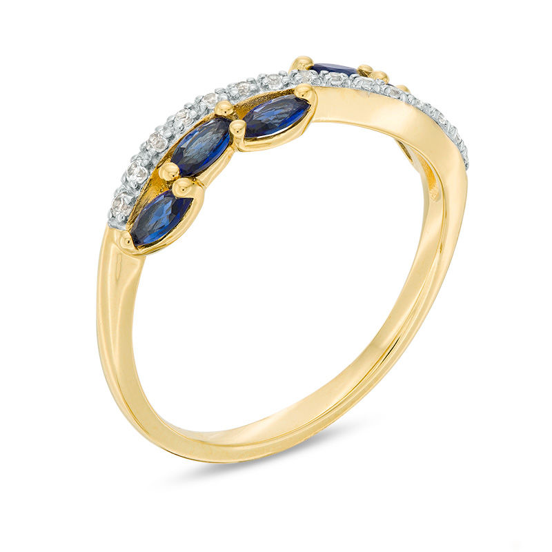 Marquise Blue Sapphire and 1/15 CT. T.W. Diamond Swirl Ribbon Ring in 10K Gold