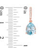 Thumbnail Image 1 of Pear-Shaped Sky Blue Topaz and 1/15 CT. T.W. Diamond Drop Earrings in 10K Rose Gold