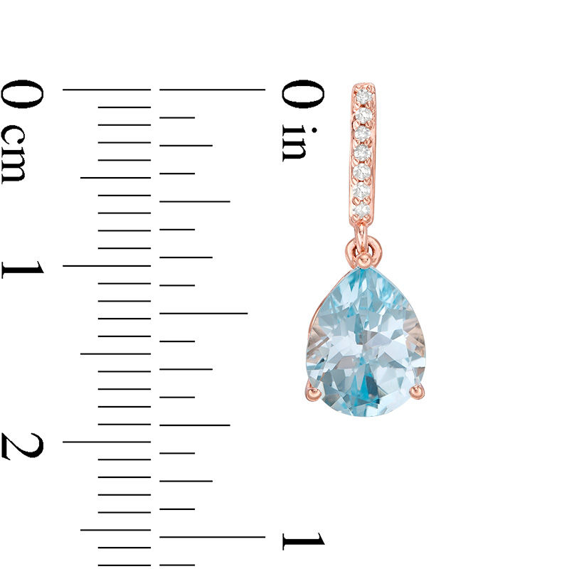 Main Image 2 of Pear-Shaped Sky Blue Topaz and 1/15 CT. T.W. Diamond Drop Earrings in 10K Rose Gold