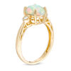 Thumbnail Image 2 of Oval Cabochon Opal and 1/20 CT. T.W. Diamond Ring in 10K Gold