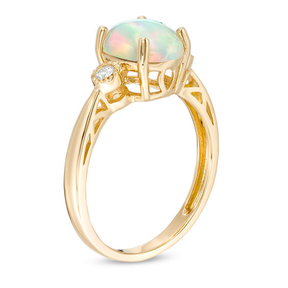 Oval Cabochon Opal and 1/20 CT. T.w. Diamond Ring in 10K Gold
