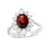 Thumbnail Image 1 of Oval Garnet and White Topaz Frame Ring in Sterling Silver