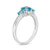 Blue Topaz and Diamond Accent Three Stone Ring in Sterling Silver