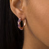 Thumbnail Image 1 of Oval Amethyst Three Stone Hoop Earrings in Sterling Silver with 18K Rose Gold Plate