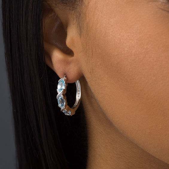 Oval Blue Topaz Three Stone Hoop Earrings in Sterling Silver